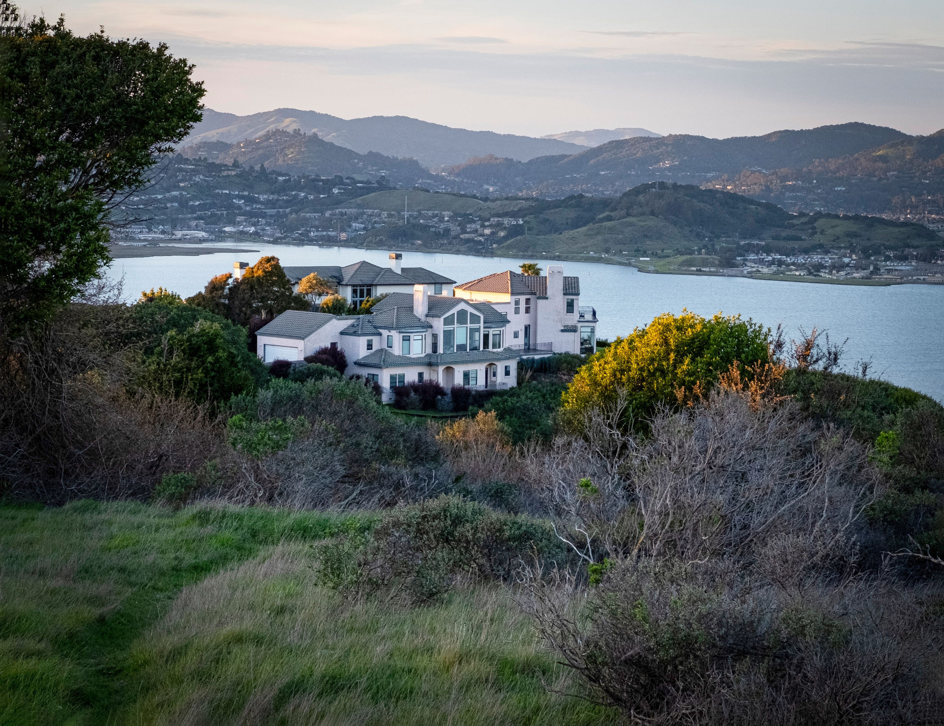 Marin County hillside home overlooking the bay at dusk